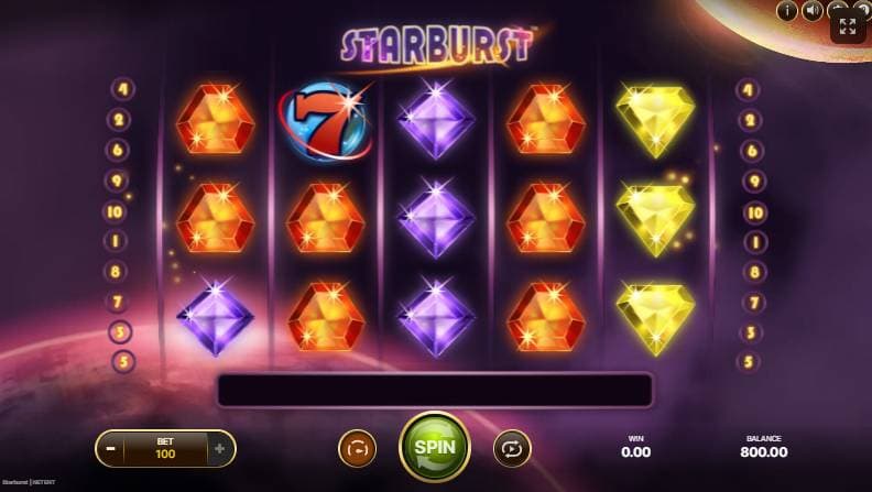 Starburst slot gameplay featuring colorful gem symbols and expanding wilds on the reels